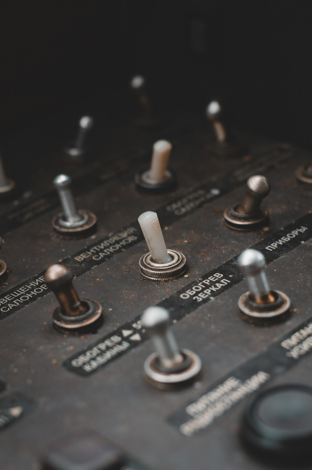 Close-up of vintage broadcast equipment dials and switches