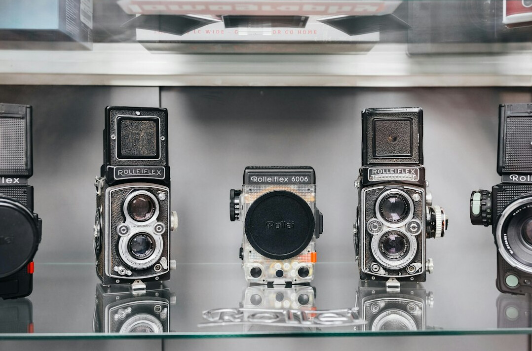 Empty vintage television studio set with large cameras